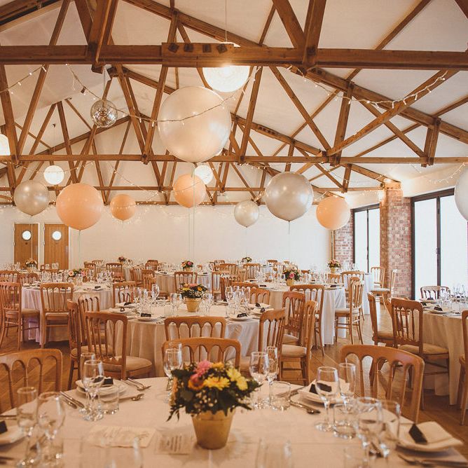Rustic Barn Reception with Plant Pot Centrepieces &amp; Giant Balloons | Fusion Rustic Indian Country Wedding at The Green Cornwall | Matt Penberthy Photography