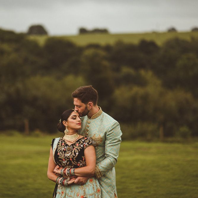 Bride &amp; Groom in Traditional Indian Wedding Attire | Fusion Rustic Indian Country Wedding at The Green Cornwall | Matt Penberthy Photography