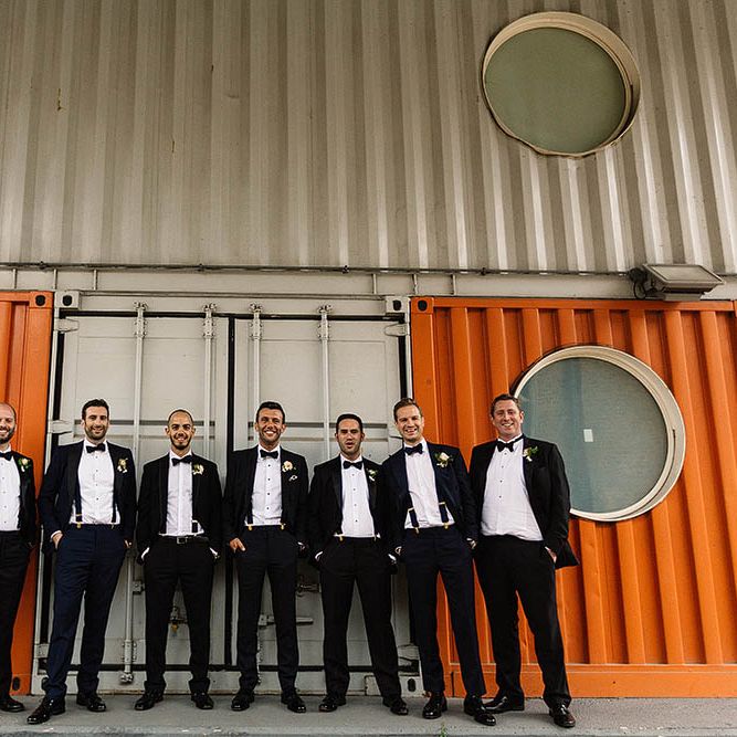 Groom &amp; Groomsmen In Black Tie // London Wedding Venue For 300 People Trinity Buoy Wharf With Bride In Suzanne Neville And Images From Paul Joseph Photography Film This Modern Revelry