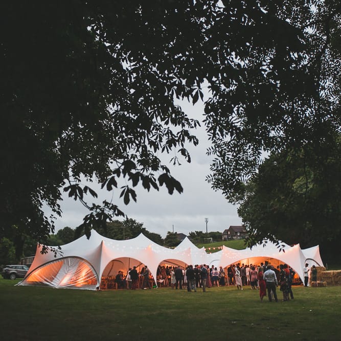 Rainy Festival Wedding In East Sussex With Bride In Rime Arodaky And Black Biker Boots And Bridesmaids In White Dresses With Silent Disco Party Images By Jesus Caballero