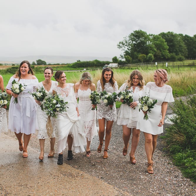 Rainy Festival Wedding In East Sussex With Bride In Rime Arodaky And Black Biker Boots And Bridesmaids In White Dresses With Silent Disco Party Images By Jesus Caballero