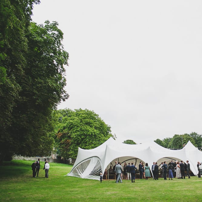 Rainy Festival Wedding In East Sussex With Bride In Rime Arodaky And Black Biker Boots And Bridesmaids In White Dresses With Silent Disco Party Images By Jesus Caballero