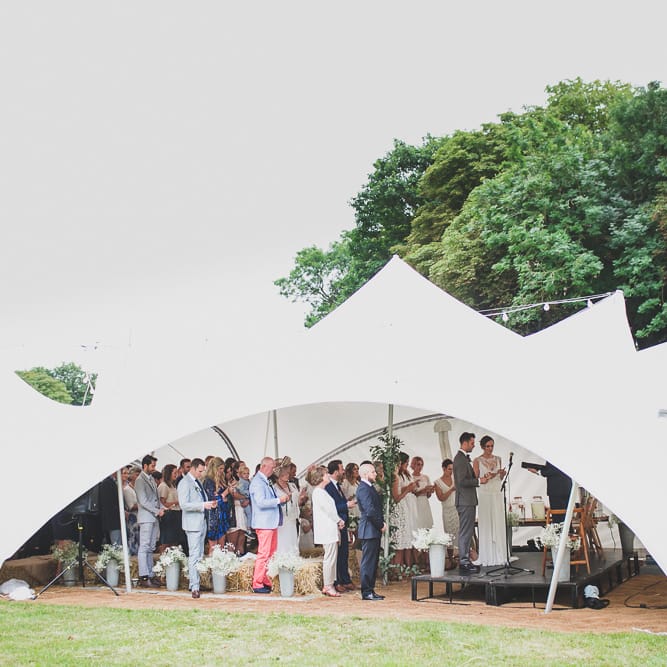 Rainy Festival Wedding In East Sussex With Bride In Rime Arodaky And Black Biker Boots And Bridesmaids In White Dresses With Silent Disco Party Images By Jesus Caballero