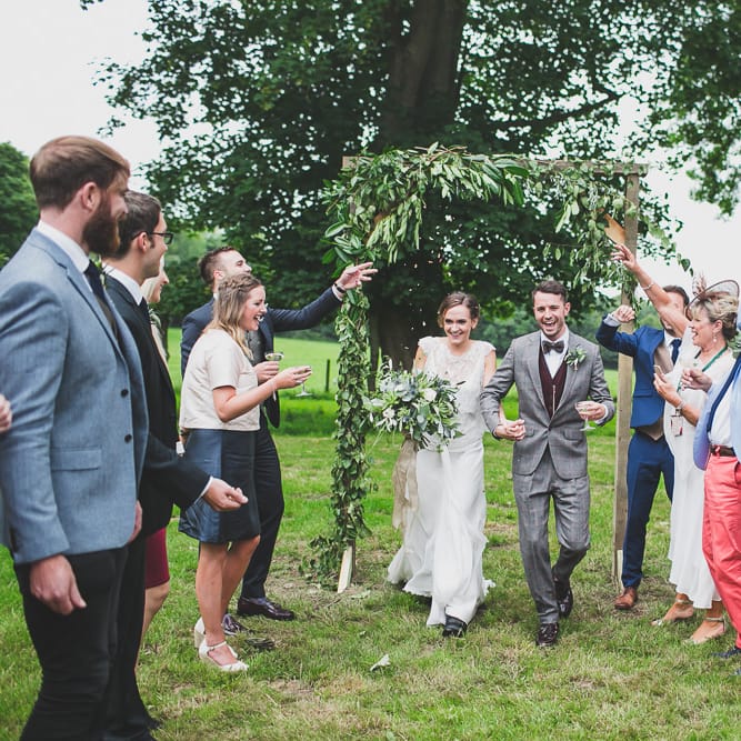 Rainy Festival Wedding In East Sussex With Bride In Rime Arodaky And Black Biker Boots And Bridesmaids In White Dresses With Silent Disco Party Images By Jesus Caballero