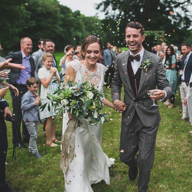Rainy Festival Wedding In East Sussex With Bride In Rime Arodaky And Black Biker Boots And Bridesmaids In White Dresses With Silent Disco Party Images By Jesus Caballero