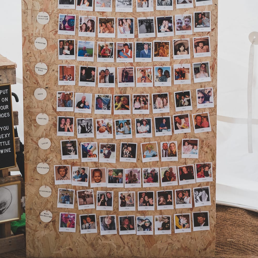 Polaroid Of Guests Table Plan For Wedding // Rainy Festival Wedding In East Sussex With Bride In Rime Arodaky And Black Biker Boots And Bridesmaids In White Dresses With Silent Disco Party Images By Jesus Caballero