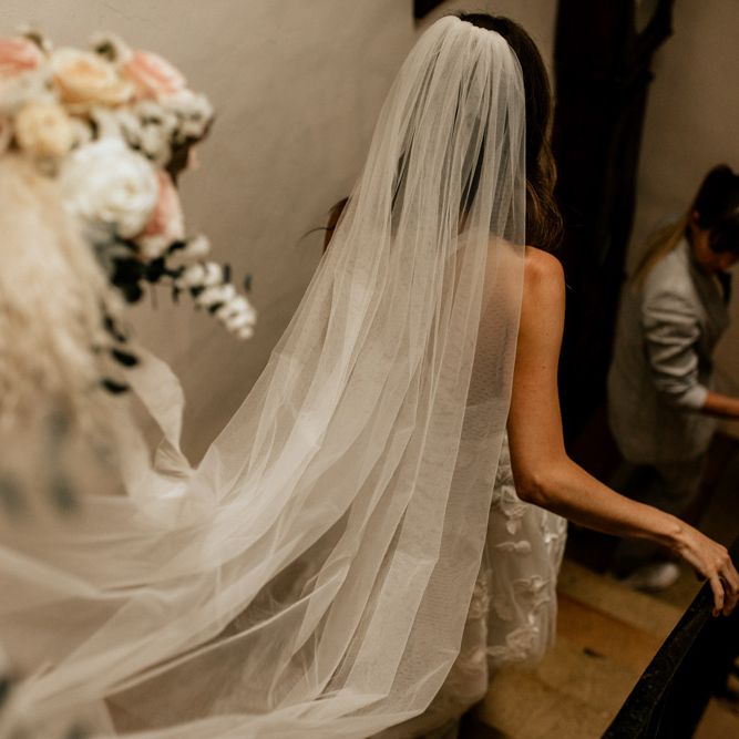 Bridal Entrance in Emma Beaumont Wedding Dress and Cathedral Length Wedding Veil