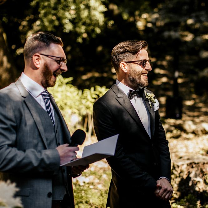 Groom at the Altar in a Black Tie Suit Waiting for His Bride