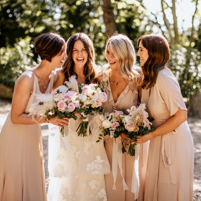 Bridal Party Portrait with Bridesmaids in Pink Reformation Dresses and Bride in Emma Beaumont Wedding Dress