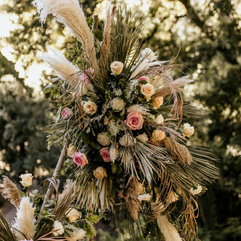 Naked Tipi Wedding Flowers with Dried Grasses and Pink and Cream Roses