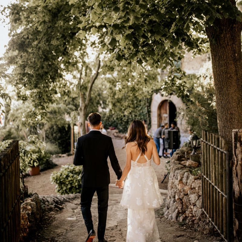 Bride in Emma Beaumont Wedding Dress and Groom in Givenchy Tuxedo