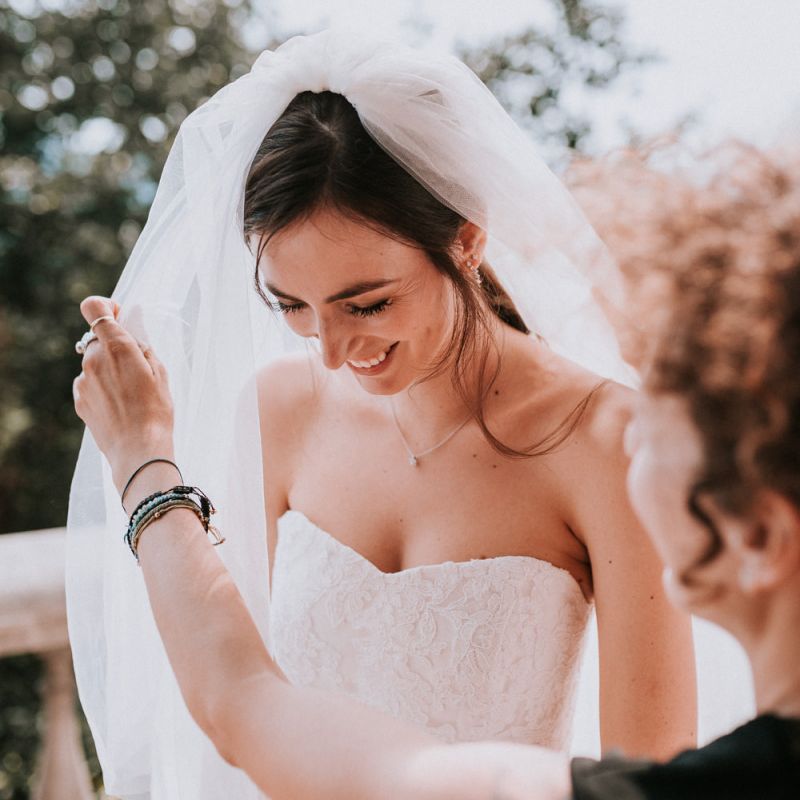 Bride in strapless Pronovias bride dress with  pastel bouquet