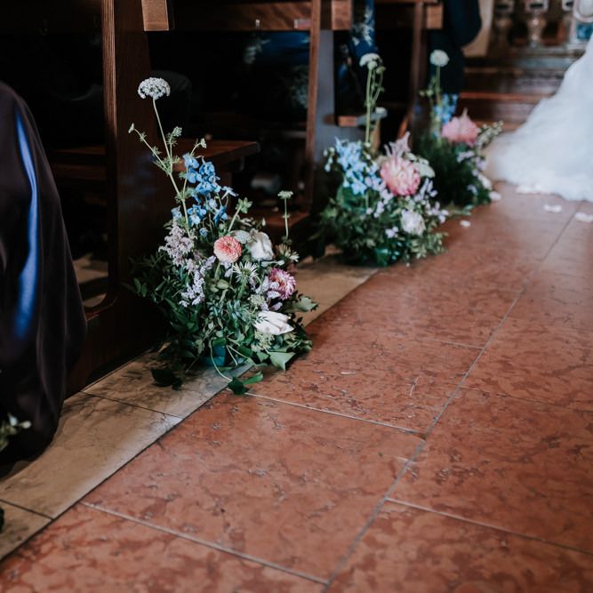 Pastel wedding flowers for aisle decor