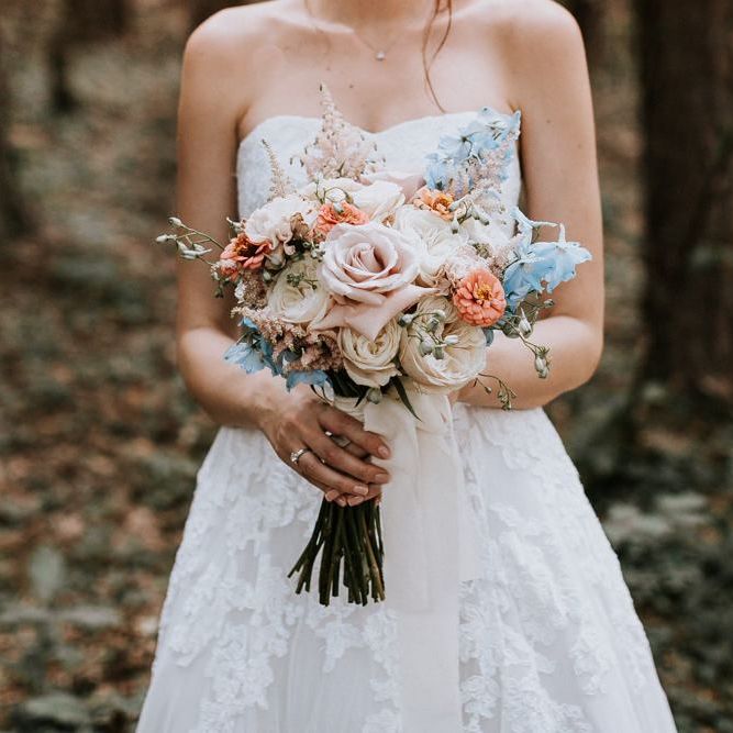 Pastel bouquet for bride in strapless Pronovias dress