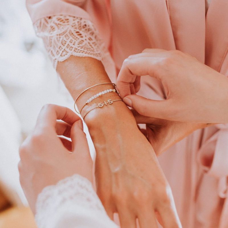 Bridal jewellery at Italian wedding with  pastel bouquet