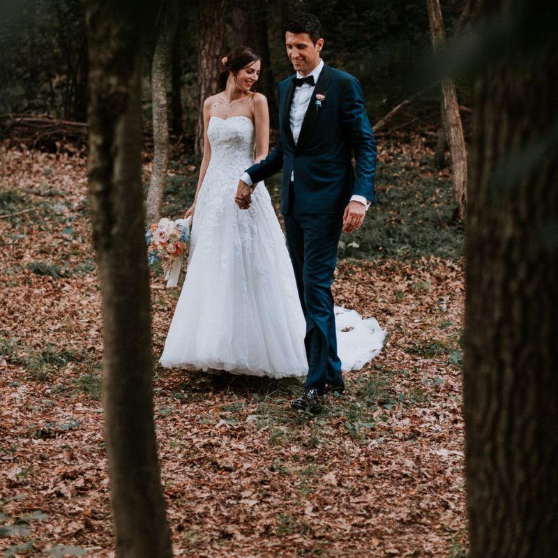 Bride and groom with pastel bouquet