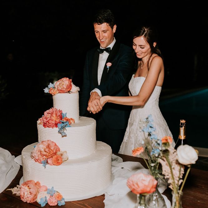 Bride and groom cut the wedding cake