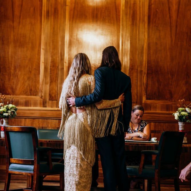 Bride and  Groom Embrace During Ceremony
