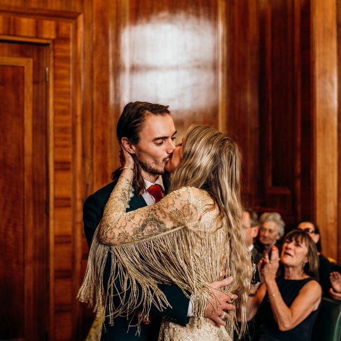 Bride and Groom Kiss During Ceremony