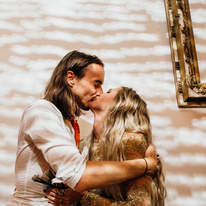 Bride and Groom Kiss During Reception