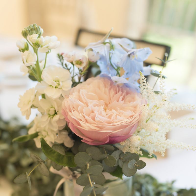 Pink, Blue and White Flowers in Glass Jar | Eucalyptus Top Table Runner | Tipi Wedding Reception at Udimore Village Hall, East Sussex | Morris Minor Wedding Car, Hanging Flowers in Bottles and Town Crier for Village Hall Wedding in Rye | Eleanor Jane Photography
