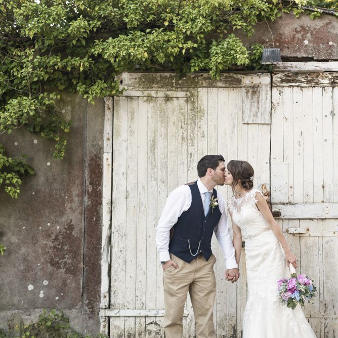 Bride in Lacy Fishtail Stella York Gown with Plunging V Back and Diamante Charm on Champagne Ribbon Belt | Summer Bridal Bouquet with Purple and Blue Flowers and Eucalyptus | Groom in Blue Jacket and Waistcoat with Camel Chinos | Morris Minor Wedding Car, Hanging Flowers in Bottles and Town Crier for Village Hall Wedding in Rye | Eleanor Jane Photography