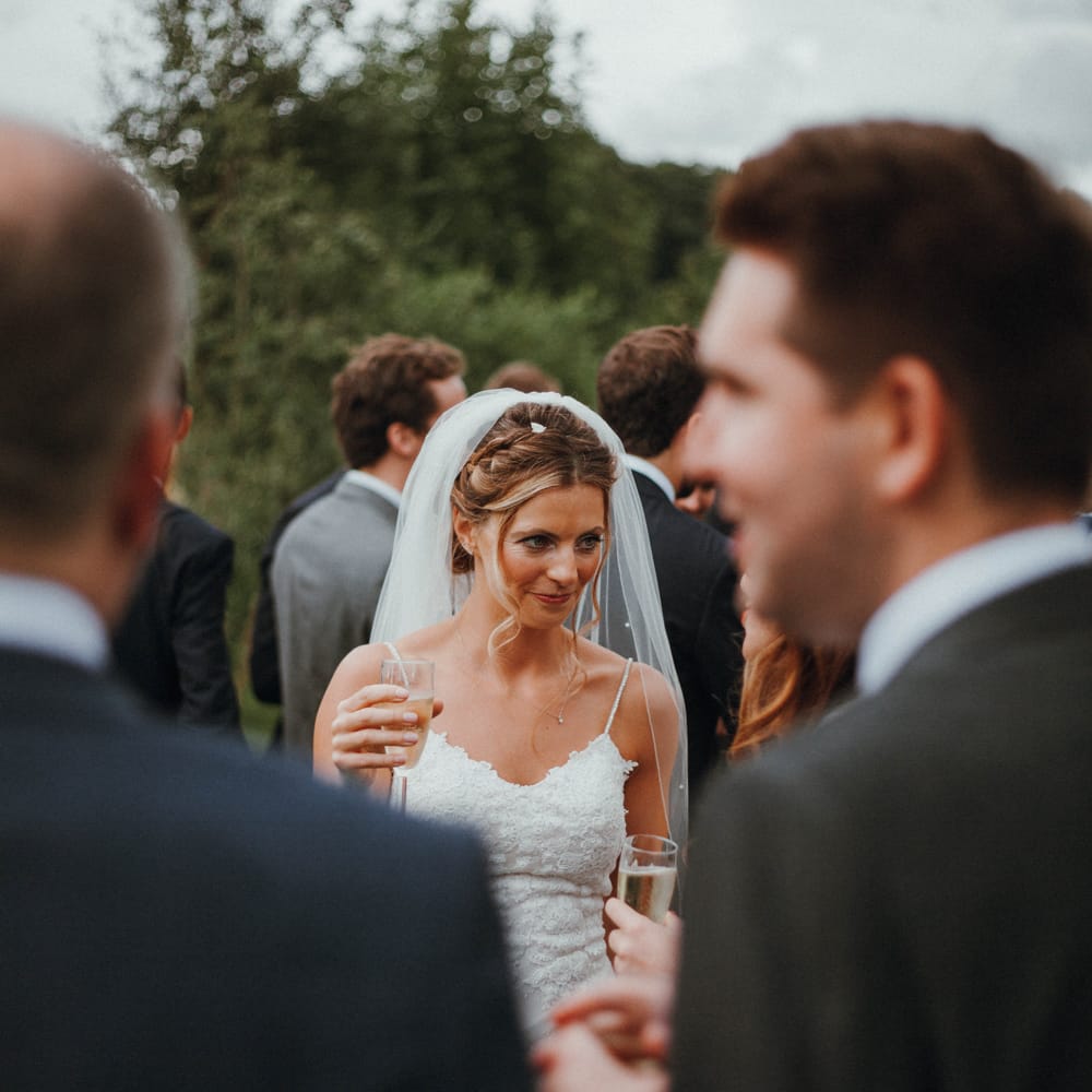 Bride In Enzoani  Wedding Dress // Glastonbury Themed Table Plan For Wedding At Stone Barn Cotwolds With Groom In Cad &amp; The Dandy Images Meghan Lorna