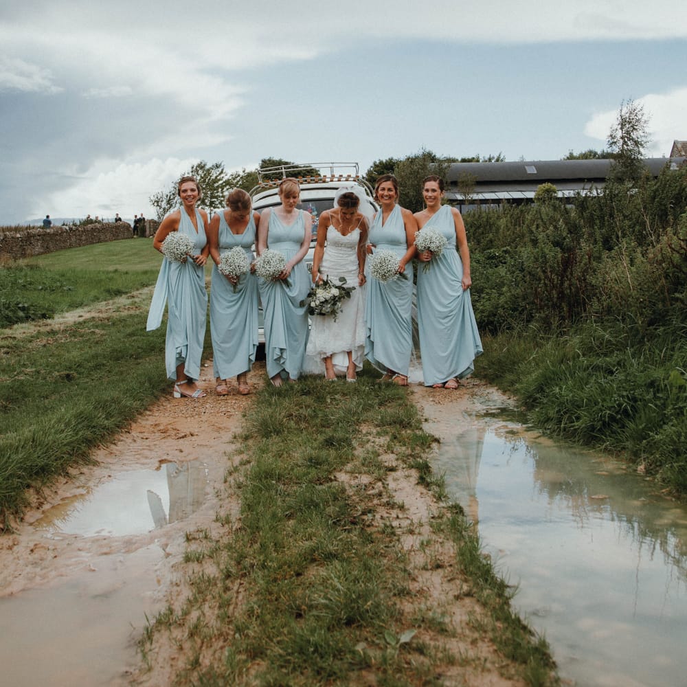 Bridesmaids In Baby Blue Mulitway Dresses // Glastonbury Themed Table Plan For Wedding At Stone Barn Cotwolds With Groom In Cad &amp; The Dandy Images Meghan Lorna