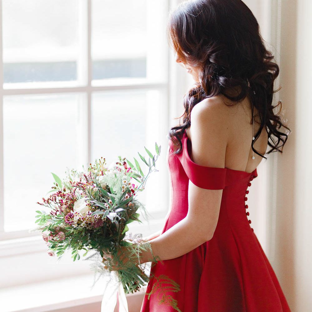 Bride in Bespoke Red Dress from Agape Bridal Boutique | Red New Years Eve Winter Wedding at Iscoyd Park, Shropshire | White Stag Wedding Photography | Lovetwofilm