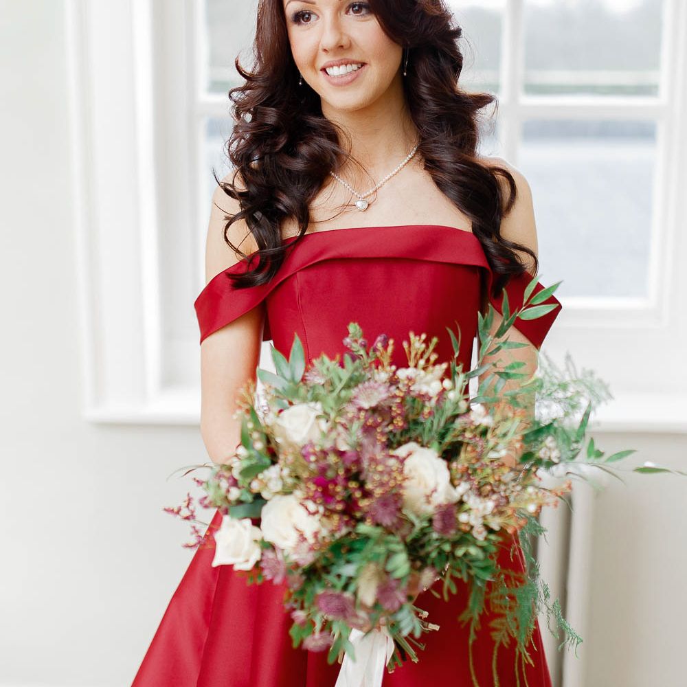 Beautiful Bride in Bespoke Red Wedding Dress from Agape Bridal Boutique | Red New Years Eve Winter Wedding at Iscoyd Park, Shropshire | White Stag Wedding Photography | Lovetwofilm
