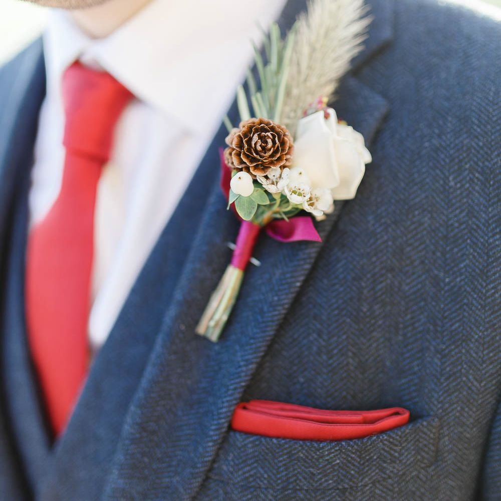 Winter Buttonhole | Red New Years Eve Winter Wedding at Iscoyd Park, Shropshire | White Stag Wedding Photography | Lovetwofilm