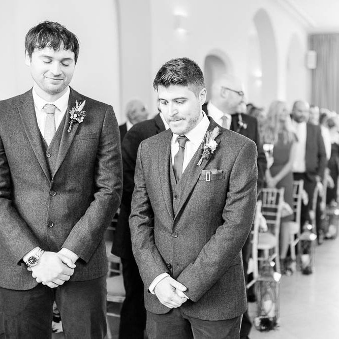 Groom at the Aisle in Slater Suit | Red New Years Eve Winter Wedding at Iscoyd Park, Shropshire | White Stag Wedding Photography | Lovetwofilm