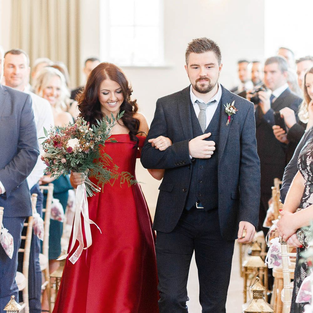 Wedding Ceremony | Bridal Entrance in Bespoke Red Gown from Agape Bridal Boutique | Red New Years Eve Winter Wedding at Iscoyd Park, Shropshire | White Stag Wedding Photography | Lovetwofilm