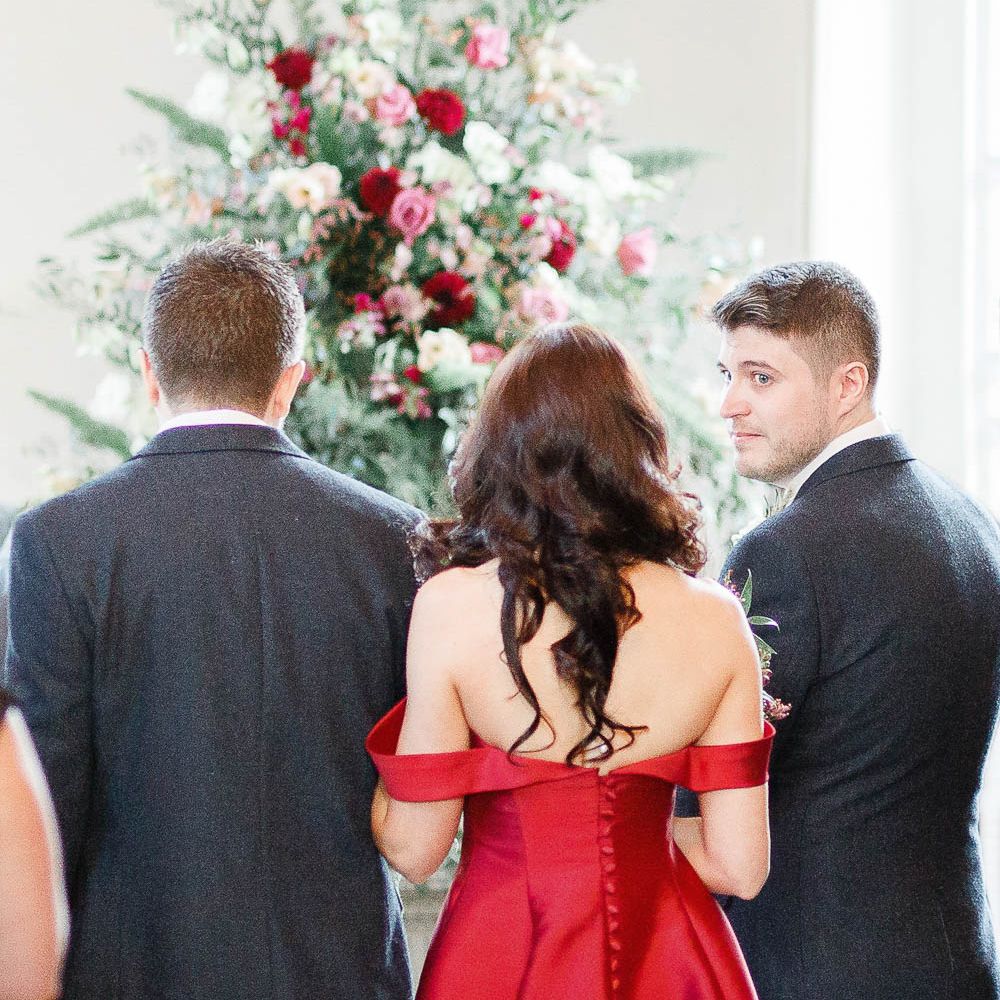 Wedding Ceremony | Bride in Bespoke Red Gown from agape Bridal Boutique | Groom in Slaters Suit | Red New Years Eve Winter Wedding at Iscoyd Park, Shropshire | White Stag Wedding Photography | Lovetwofilm