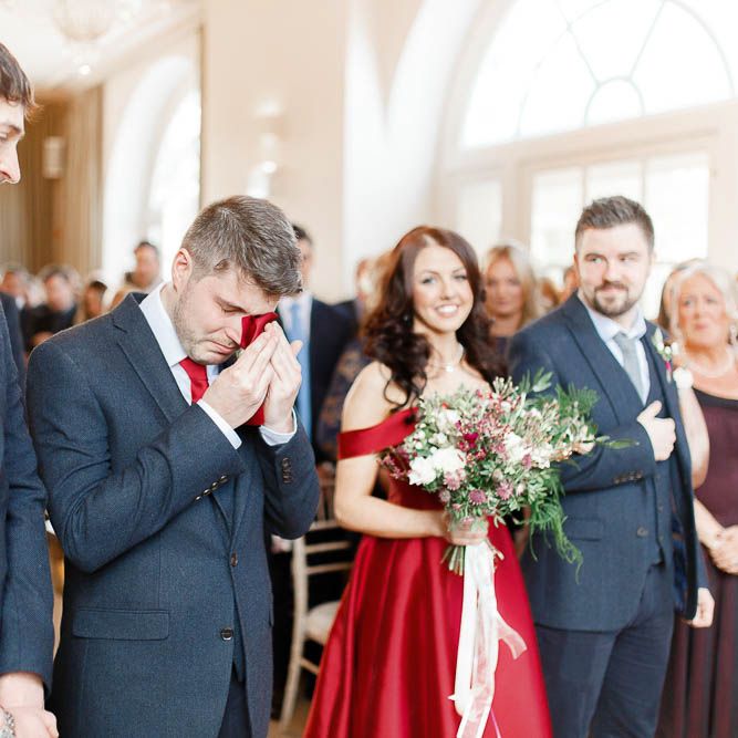 Wedding Ceremony | Bride in Bespoke Red Gown from agape Bridal Boutique | Groom in Slaters Suit | Red New Years Eve Winter Wedding at Iscoyd Park, Shropshire | White Stag Wedding Photography | Lovetwofilm