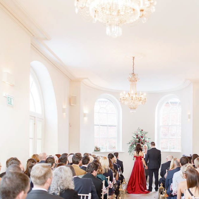 Wedding Ceremony | Bride in Bespoke Red Gown from agape Bridal Boutique | Groom in Slaters Suit | Red New Years Eve Winter Wedding at Iscoyd Park, Shropshire | White Stag Wedding Photography | Lovetwofilm