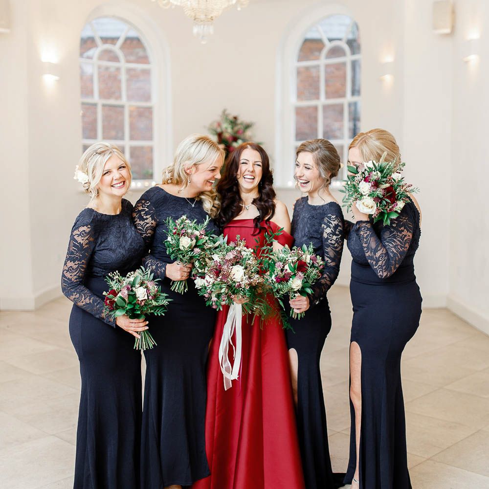 Bridal Party | Bridesmaids in Lace Navy Dresses | Bride in Bespoke Red Gown from agape Bridal Boutique | Red New Years Eve Winter Wedding at Iscoyd Park, Shropshire | White Stag Wedding Photography | Lovetwofilm