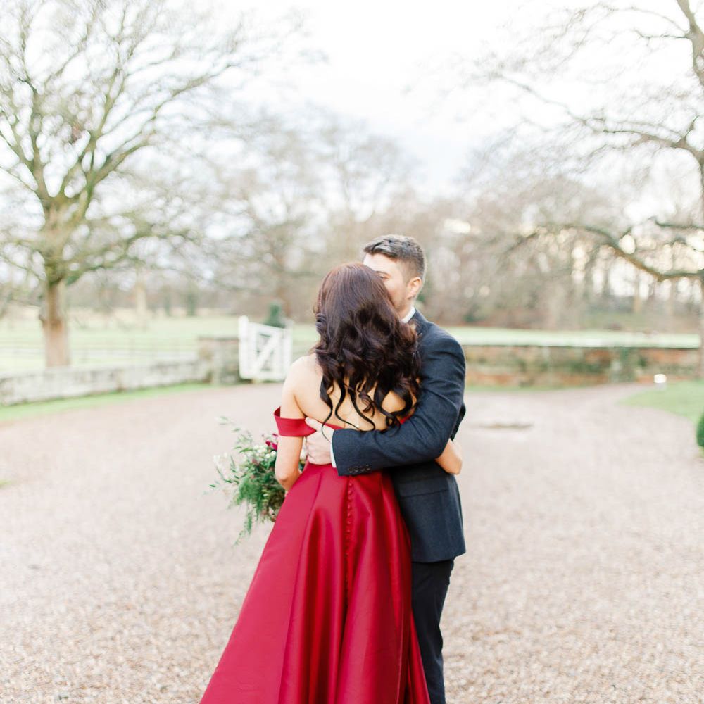 Bride in Bespoke Red Gown from agape Bridal Boutique | Groom in Slaters Suit | Red New Years Eve Winter Wedding at Iscoyd Park, Shropshire | White Stag Wedding Photography | Lovetwofilm