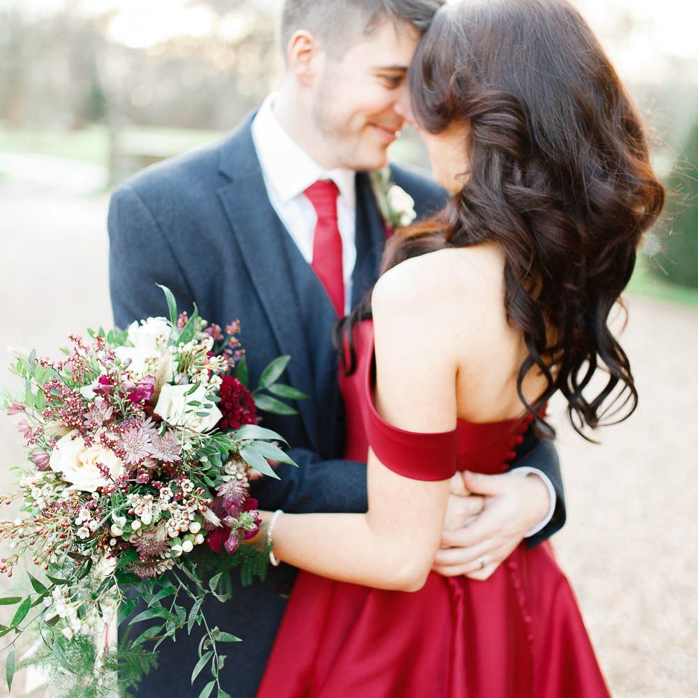 Bride in Bespoke Red Gown from agape Bridal Boutique | Groom in Slaters Suit | Red New Years Eve Winter Wedding at Iscoyd Park, Shropshire | White Stag Wedding Photography | Lovetwofilm