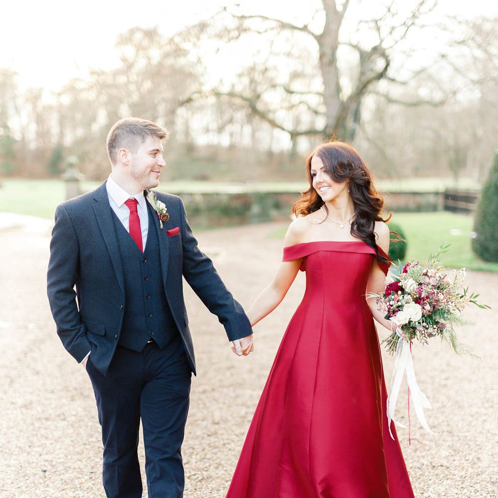 Bride in Bespoke Red Gown from agape Bridal Boutique | Groom in Slaters Suit | Red New Years Eve Winter Wedding at Iscoyd Park, Shropshire | White Stag Wedding Photography | Lovetwofilm