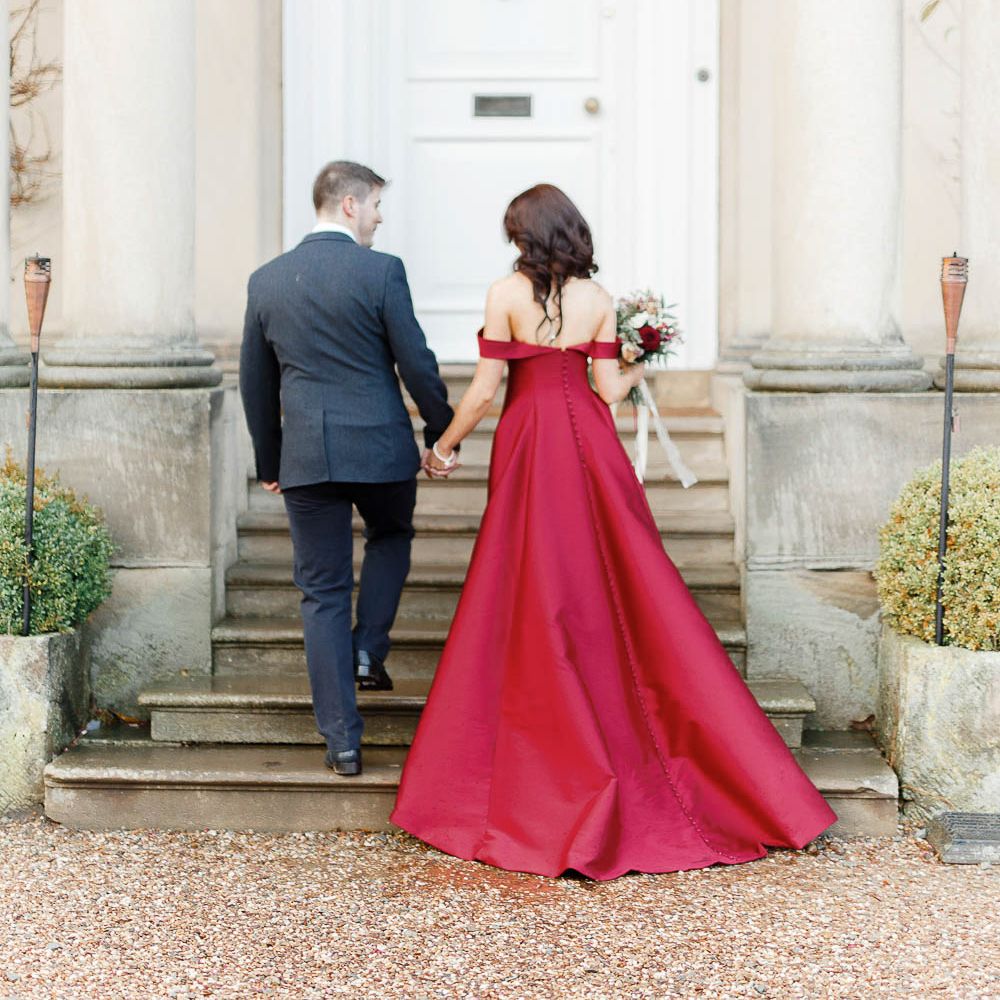Bride in Bespoke Red Gown from agape Bridal Boutique | Groom in Slaters Suit | Red New Years Eve Winter Wedding at Iscoyd Park, Shropshire | White Stag Wedding Photography | Lovetwofilm