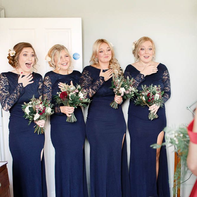 Bridal Party First Look | Bridesmaids in Navy Lace Dresses | Red New Years Eve Winter Wedding at Iscoyd Park, Shropshire | White Stag Wedding Photography | Lovetwofilm