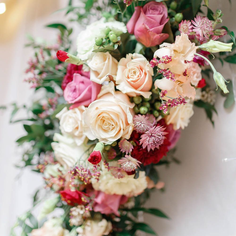 Red &amp; Pink Wedding Flowers | Floral Hoop | Wedding Reception Decor | Red New Years Eve Winter Wedding at Iscoyd Park, Shropshire | White Stag Wedding Photography | Lovetwofilm
