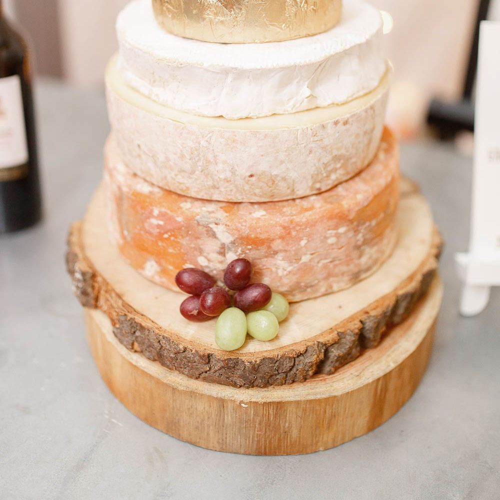 Cheese Tower Wedding Cake | Red New Years Eve Winter Wedding at Iscoyd Park, Shropshire | White Stag Wedding Photography | Lovetwofilm