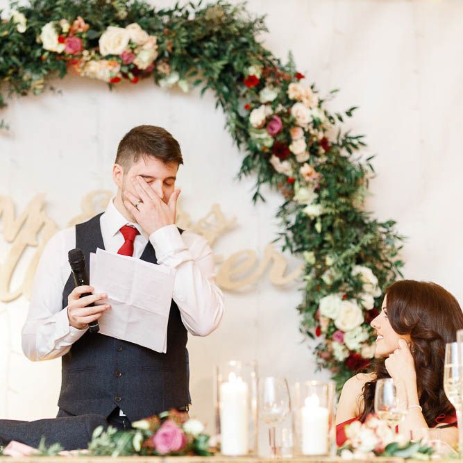Wedding Reception Speeches | Floral Hoop | Top Table Decor | Groom in Slaters Suit | Red New Years Eve Winter Wedding at Iscoyd Park, Shropshire | White Stag Wedding Photography | Lovetwofilm