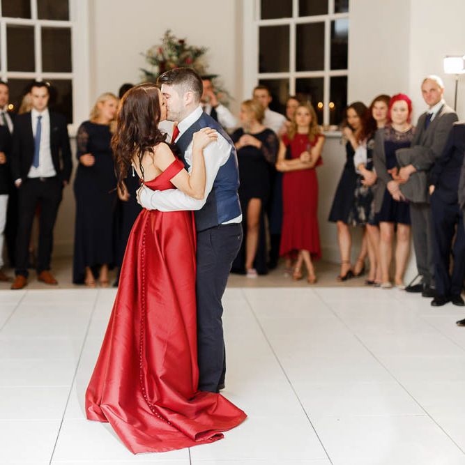 First Dance | Bride in Bespoke Red Gown from agape Bridal Boutique | Groom in Slaters Suit | Red New Years Eve Winter Wedding at Iscoyd Park, Shropshire | White Stag Wedding Photography | Lovetwofilm