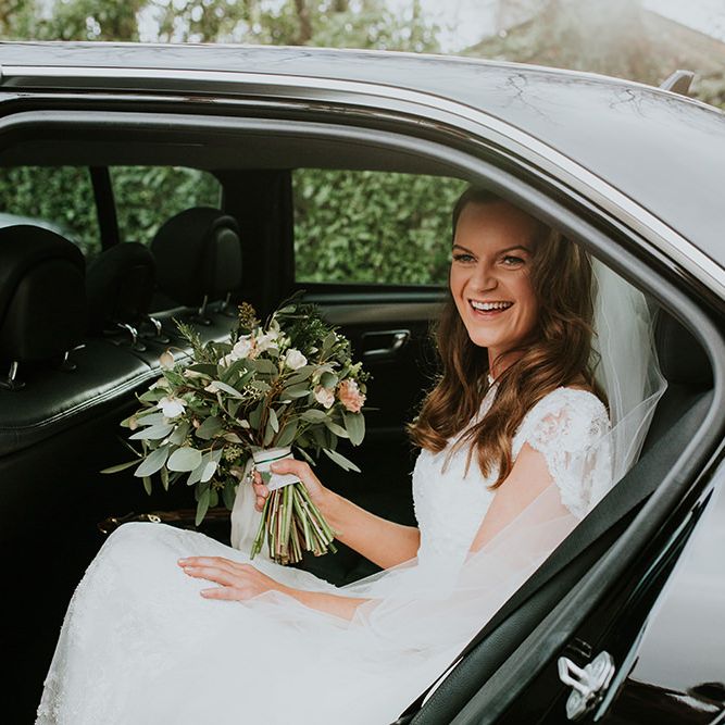Bride arrives at wedding in car