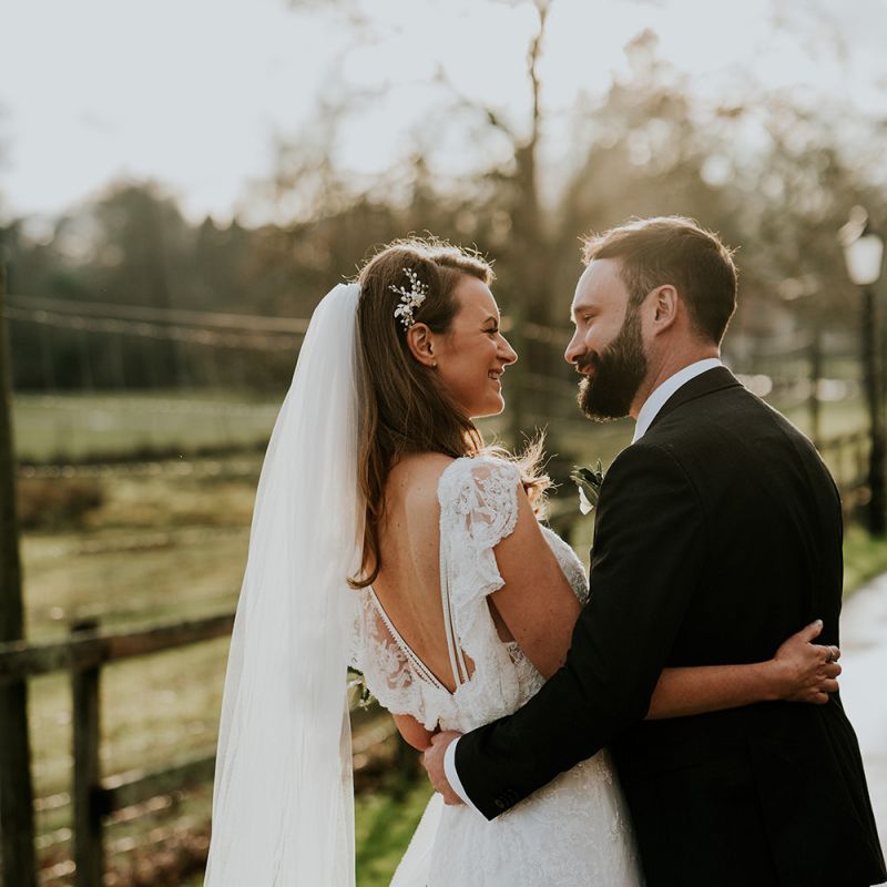 Bride in lace wedding dress with long veil