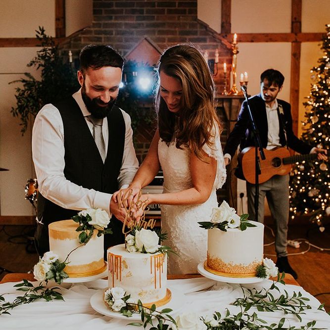 Bride and groom cut the wedding cake