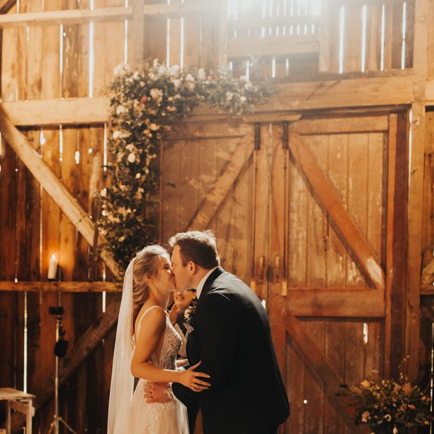 Bride and groom first kiss at Nancarrow Farm ceremony